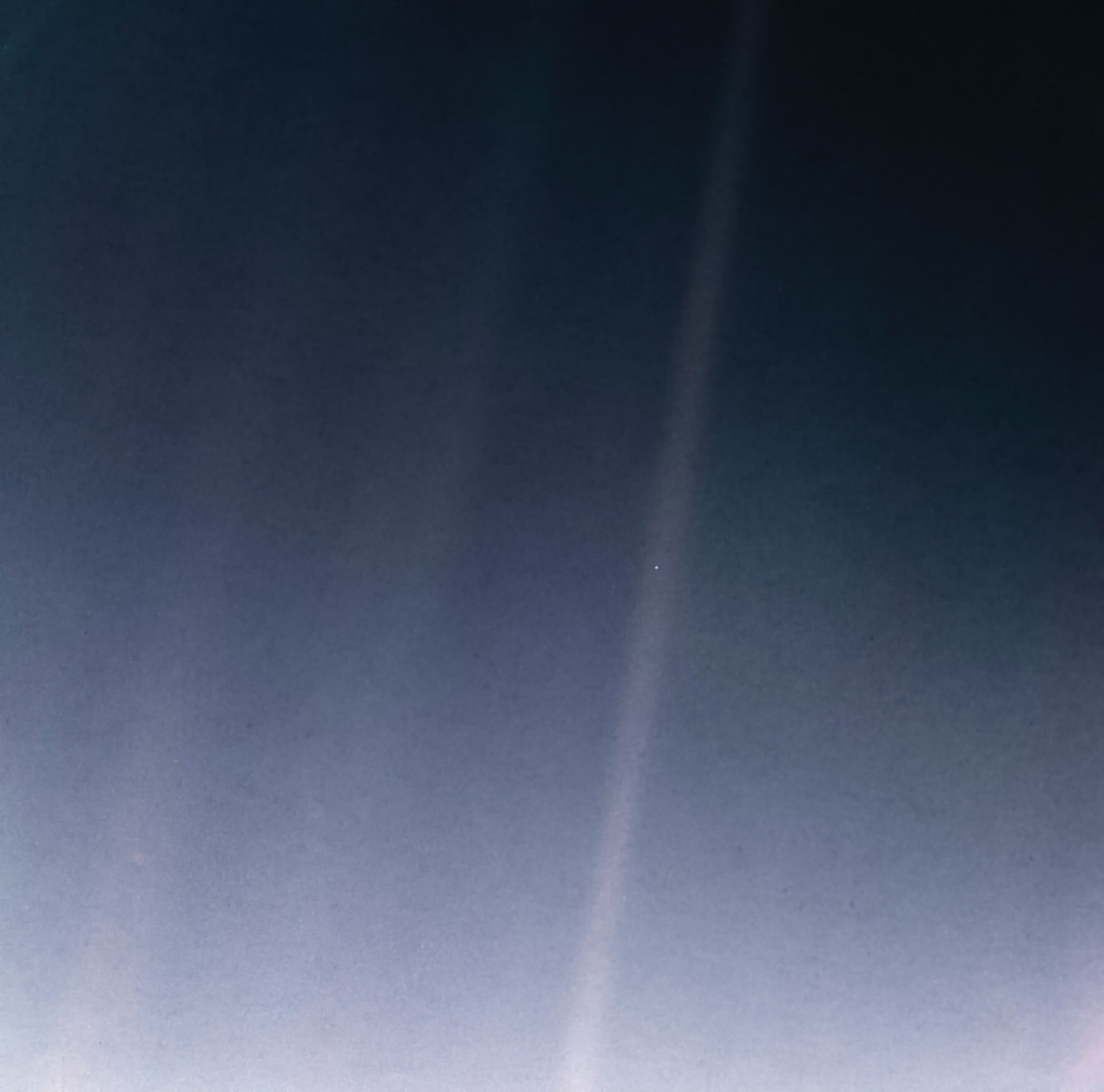 The Pale Blue Dot — Voyager 1's photograph of Earth as a tiny speck of light on a sunbeam, taken 14 February 1990 from 6 billion kilometres away.